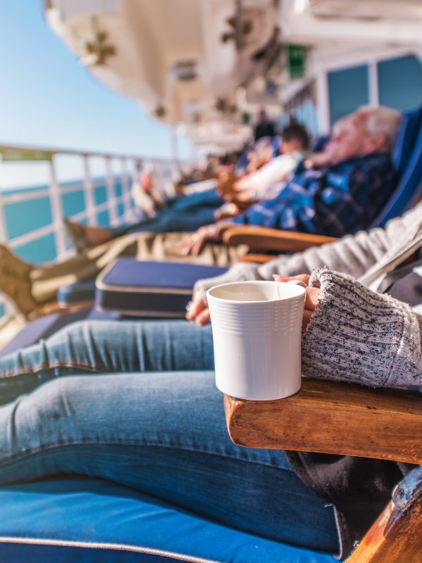 People On Cruise Ship Deck Chairs